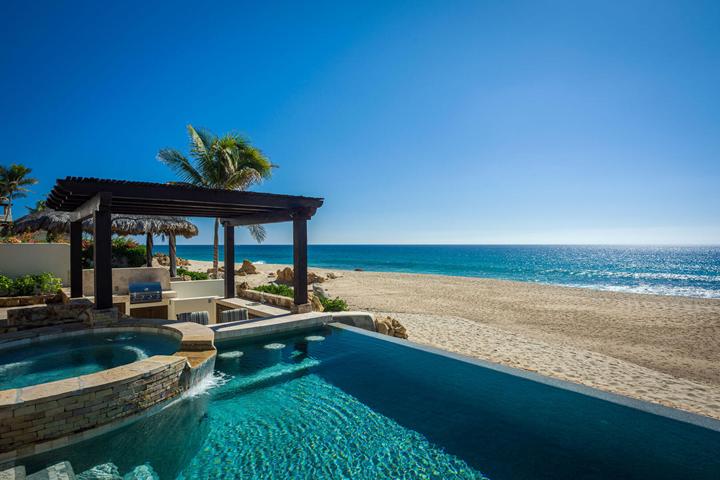 Infinity pool and pergola just above the sand at Casa Cielo in San José del Cabo